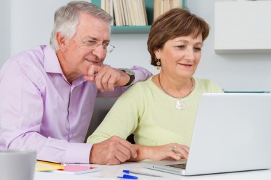 Seniors couple using a laptop computer