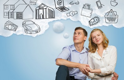 Young happy family couple dreaming of future wealthy life